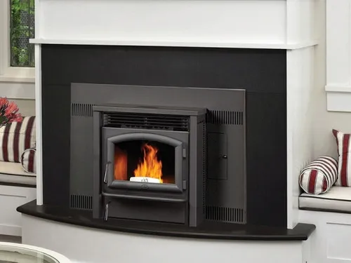 Lopi AGP Pellet Insert, a pellet-burning fireplace insert with a glass door, installed in a fireplace surround with a lit fire visible