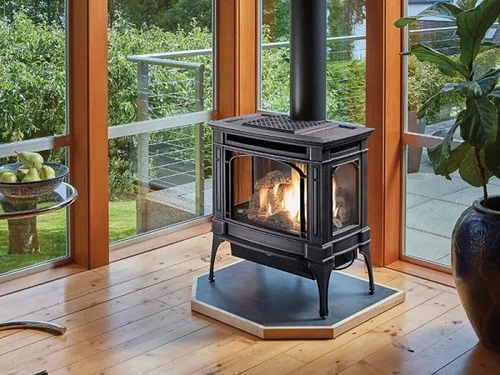 Lopi Berkshire GSR2 Gas stove, a freestanding gas-burning stove with a glass door and a lit fire visible