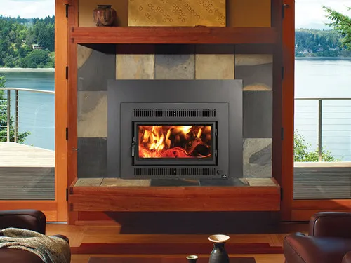 Lopi Medium Flushwood Rectangle Hybrid Wood Insert, a wood-burning fireplace insert with a glass door, installed in a fireplace surround with a lit fire visible